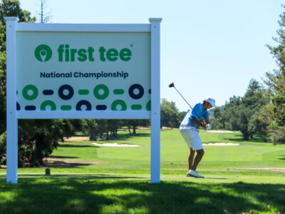 Boy hitting a tee shot at the 2023 National Championship.