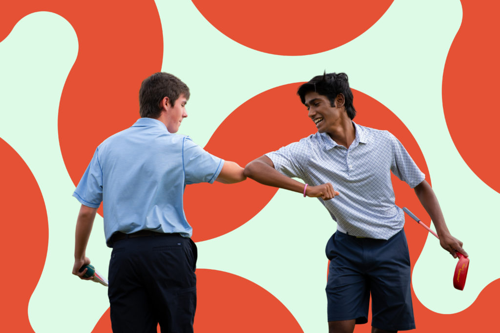 First Tee participants bumping elbows.