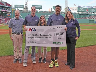 First Tee representatives posing at Fenway Park.